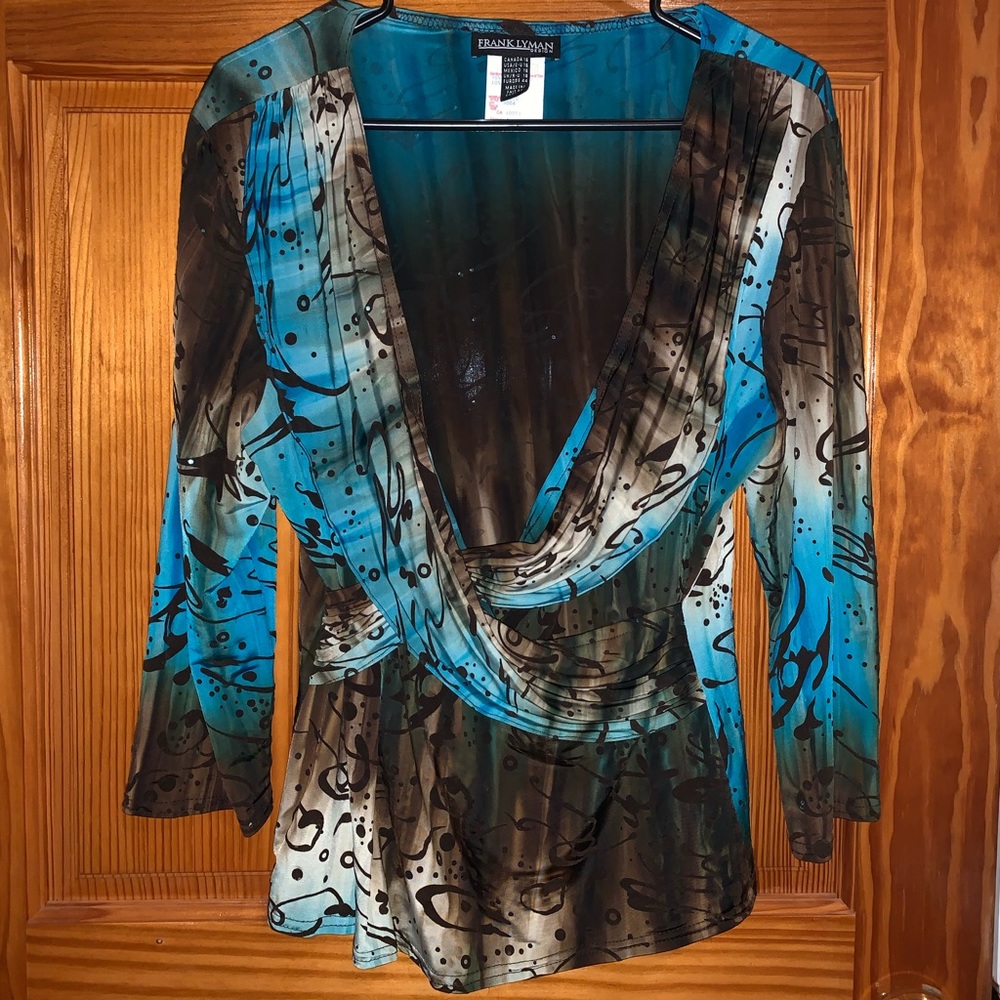 sequined, v neck blouse runs small